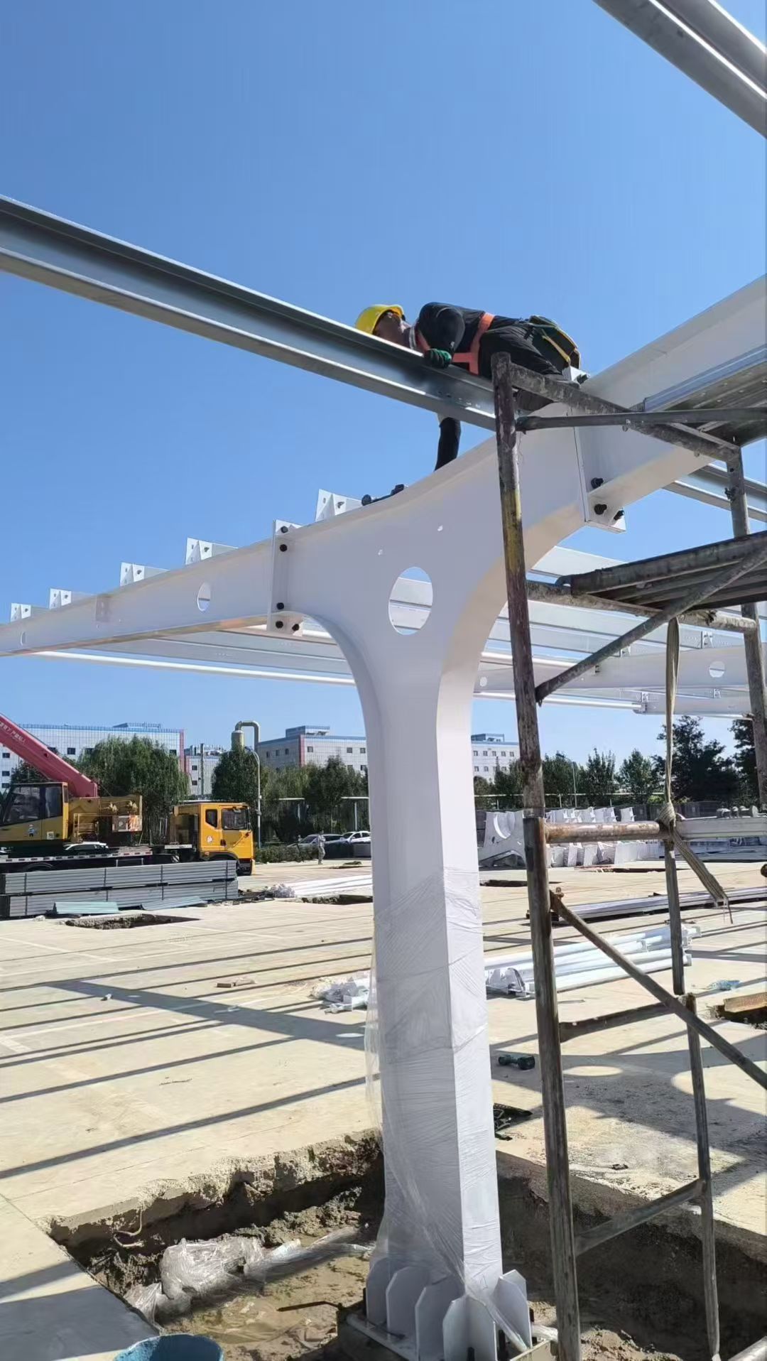 Additional view of the carport structure during on-site installation.