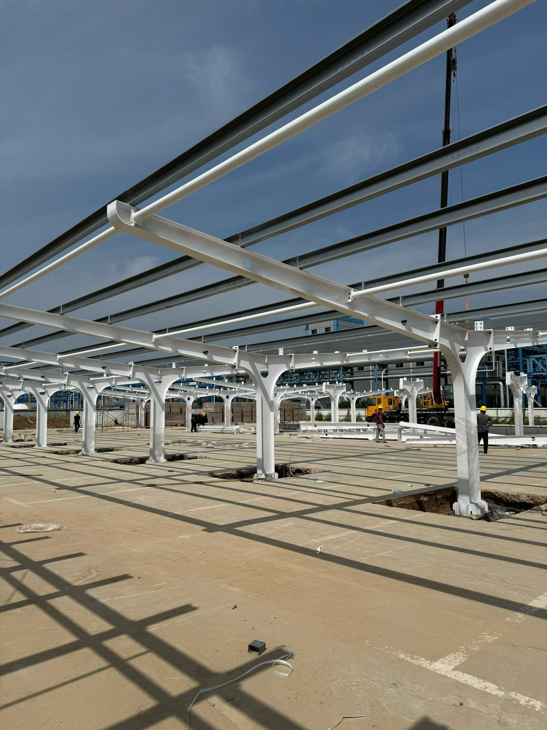 Solar carport support structures during installation at the commercial parking project in Spain